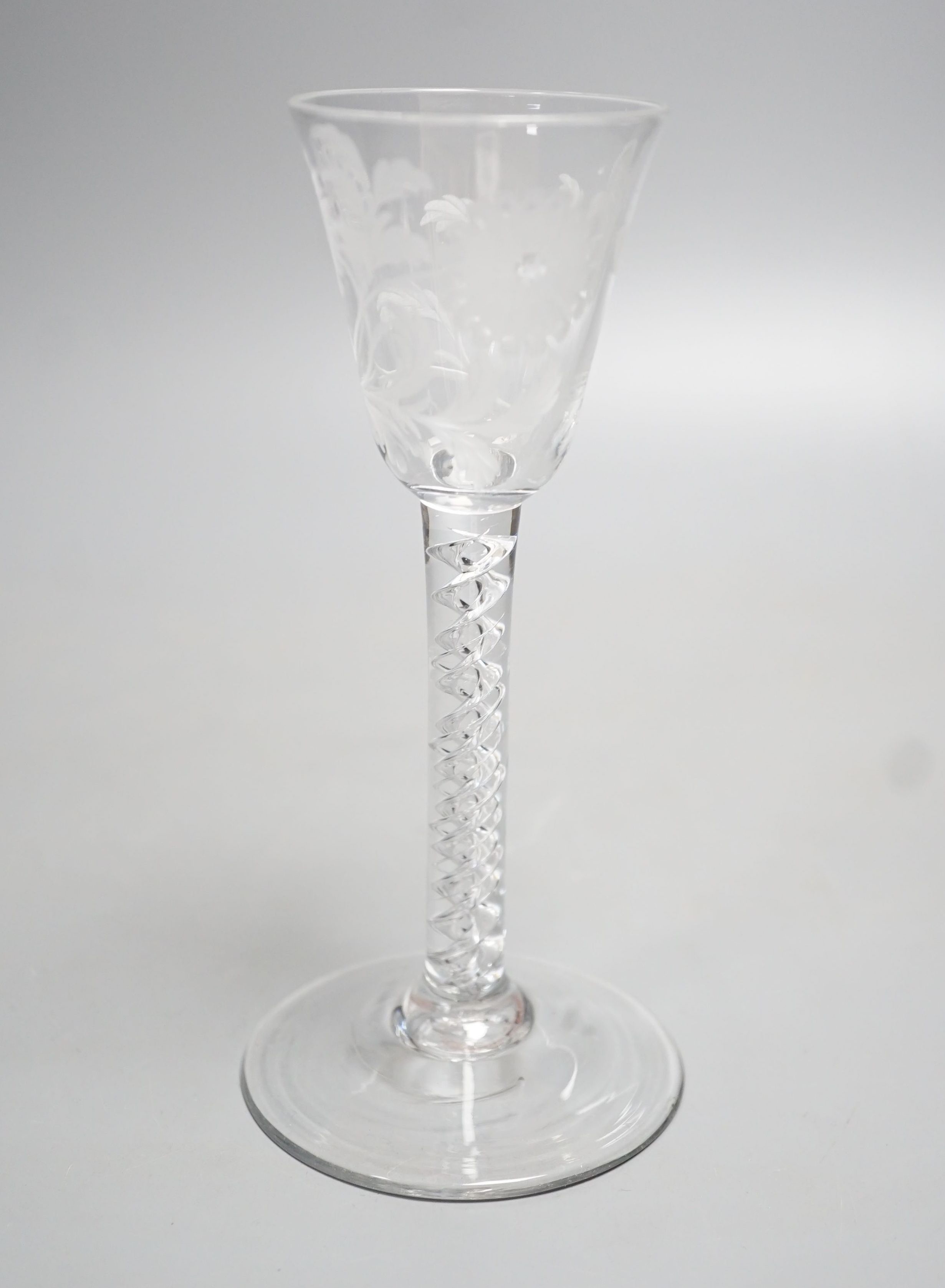 A Georgian air twist stem cordial glass, possibly later engraved with flowers and a butterfly, possibly of Jacobite significance. 16cm